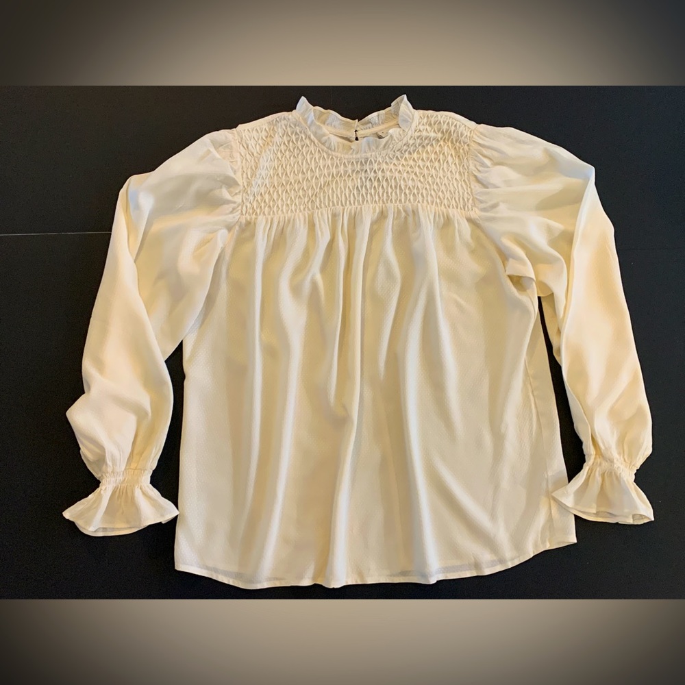 A New Day white dressy blouse.